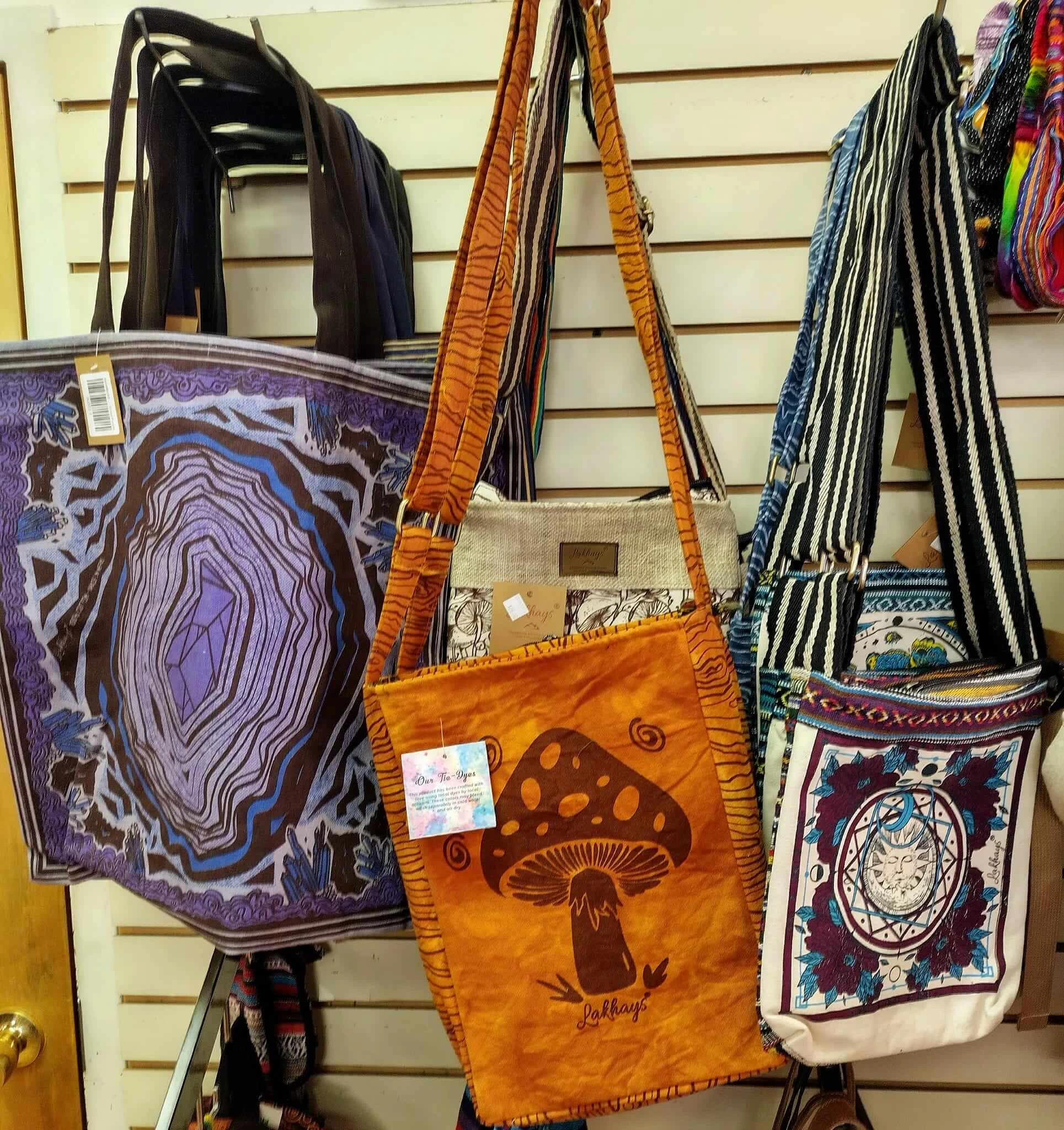 A display of various multicolored bags