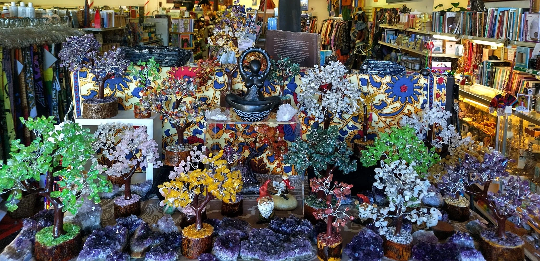 A display of wire trees with crystal gems in the branches